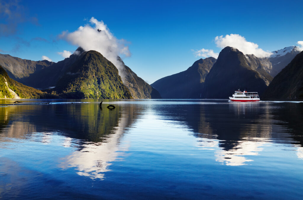 Boat going through Milford Sound in New Zealand