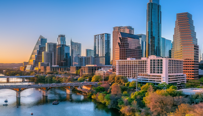 Austin, Texas- Panoramic cityscape and Colorado River against the sunset sky