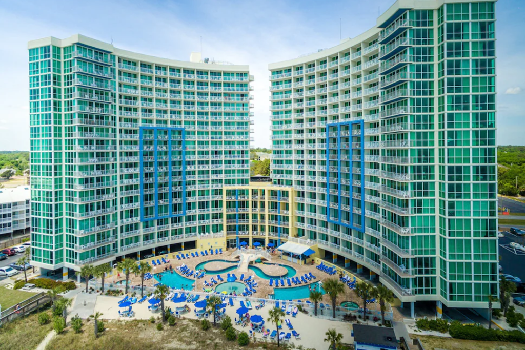 Aerial view of the Avista Resort from the beach side looking at the pools