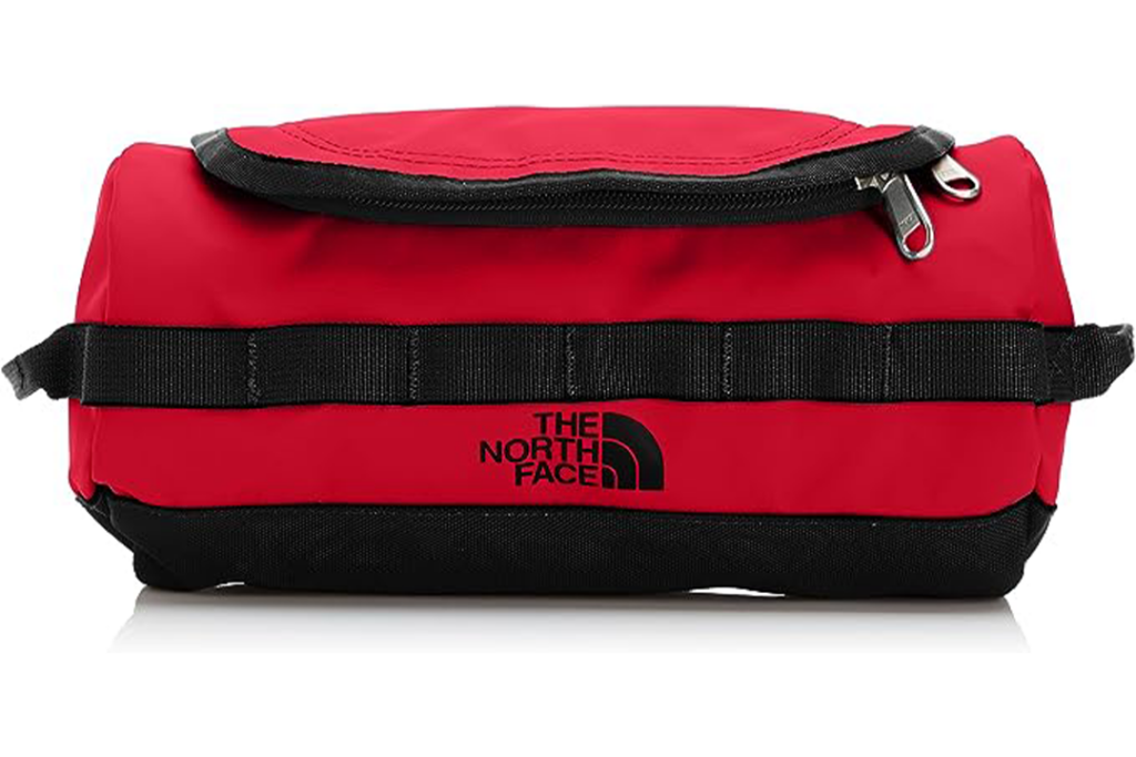 Red North Face Travel Canister on white background