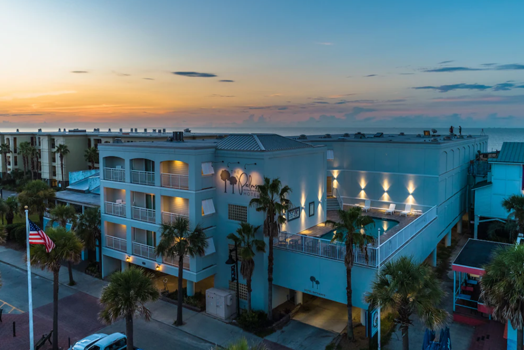 Aerial view of The Palms Oceanfront Hotel during sunset
